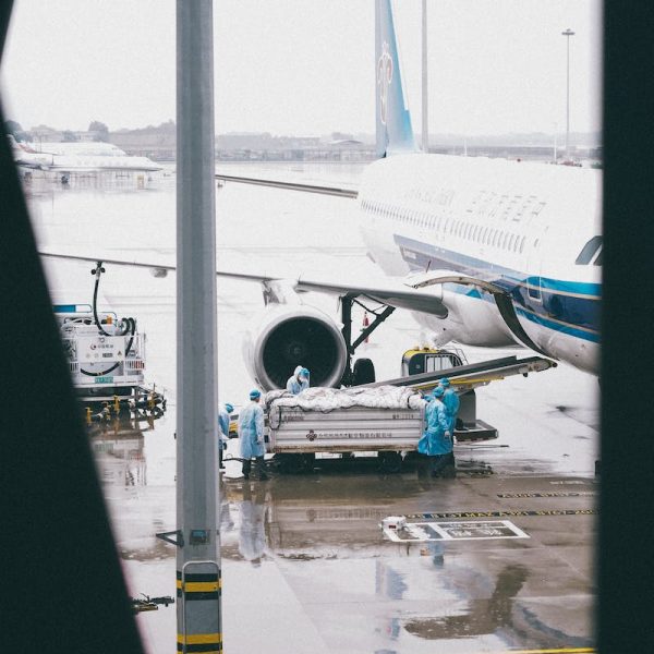 White and Blue Airplane on the Airport